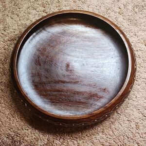 Wooden Decorative Bowl with a ceramic detailed carving on the sides.